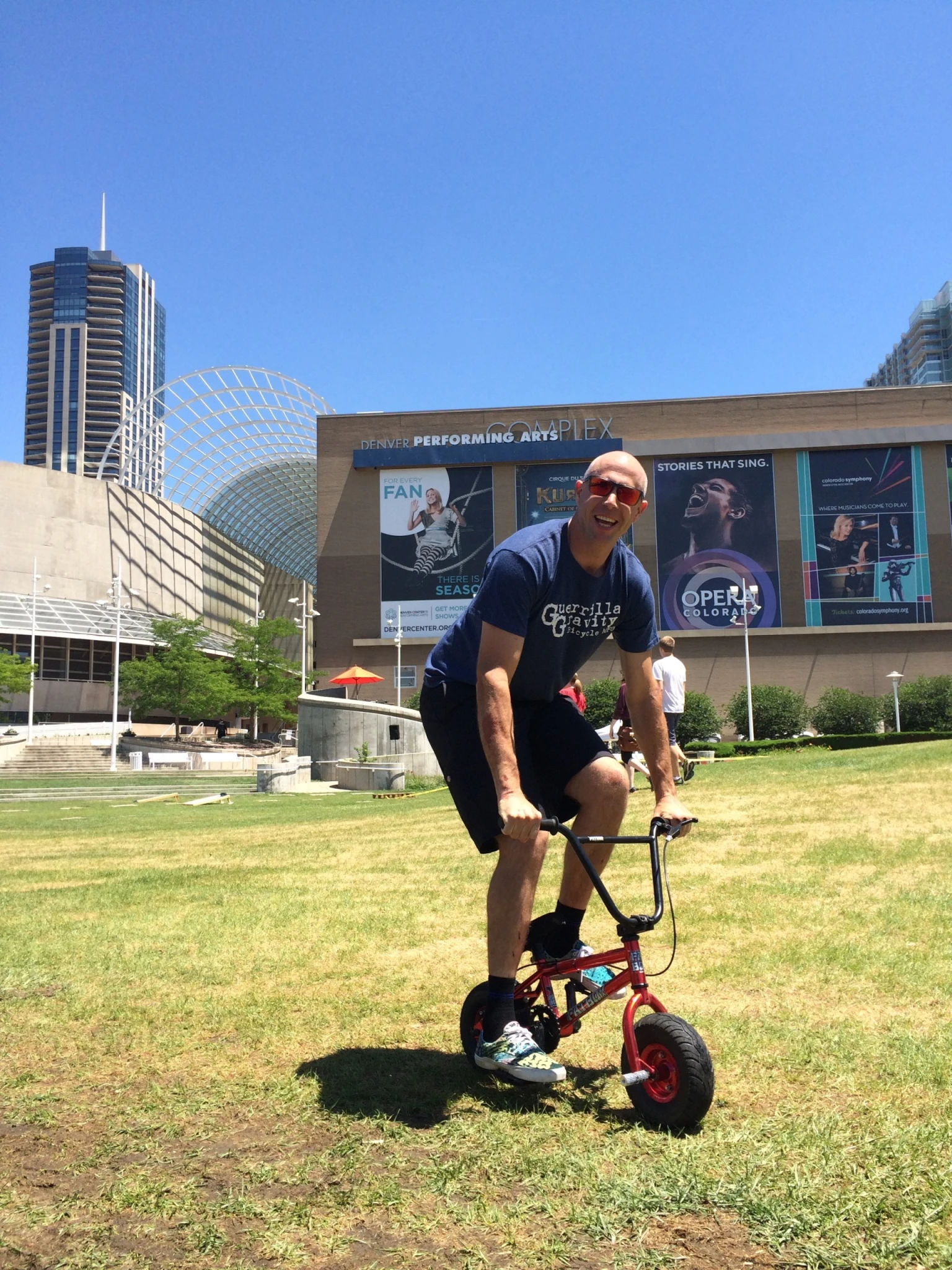 Man riding children's bicycle in Denver, CO IV therapy Denver feature image